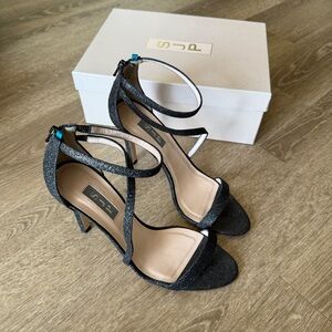 SJP Sarah Jessica Parker Serpentine Strappy black glitter heels stiletto